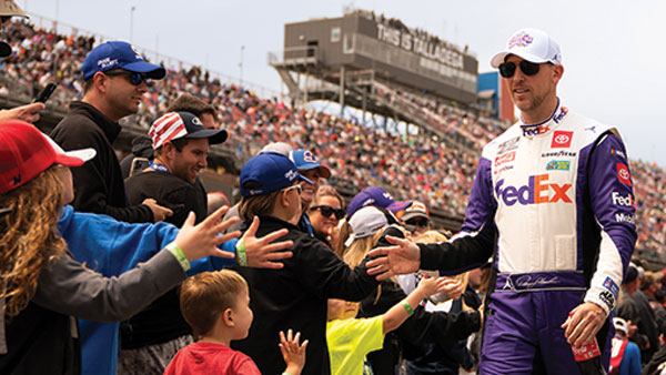 denny hamlin with fans at talladega superspeedway