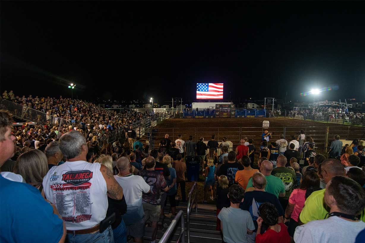 Fans watching the Buckin' Dega rodeo at night at Talladega Superspeedway